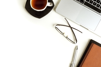 laptop and coffee on table
